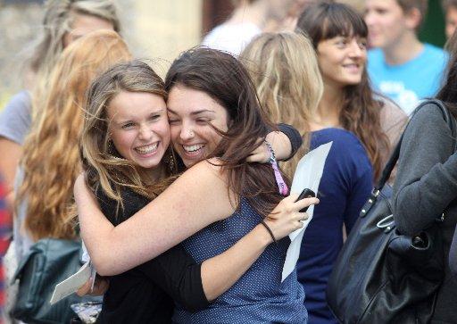 Heidi Vallier and Helena Haycock, both 16, celebrate their results at Brighton College. 
