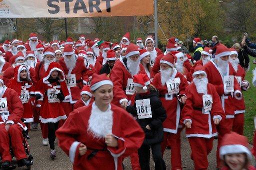 Hundreds of smiling Santas ditched the sleigh in favour of running shoes at the weekend.
The fun runners took to the streets of Crawley to raise money for a children’s hospice.
They ran a mile-long circuit around the town in aid of Chestnut Tree House