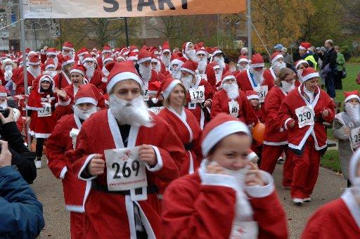 Hundreds of smiling Santas ditched the sleigh in favour of running shoes at the weekend.
The fun runners took to the streets of Crawley to raise money for a children’s hospice.
They ran a mile-long circuit around the town in aid of Chestnut Tree House