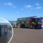 Firefighters on the beach in Hove after a bin fire on Sunday, July 10