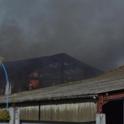 Flames were seen rising from the barn in Hailsham as smoke billowed from the building
