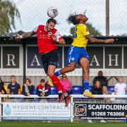 Brad Barry wins a header for Eastbourne Borough. Picture by Lydia Redman Photography