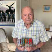 George Dunn, pictured, celebrated his 100th birthday last week. Inset shows George in the middle of his flight crew in 1943