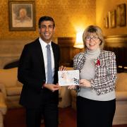 Maria Caulfield, with Prime Minister Rishi Sunak and the winning Christmas card design