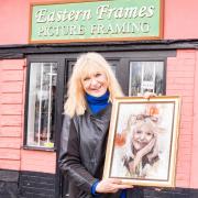 Sally Boazman with the art outside Eastern Frames in Haughley