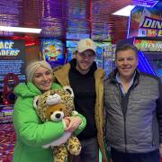 Danny Walters, who plays Keanu Taylor in Eastenders (pictured in the middle) was spotted at an arcade