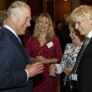 Geoff Stonebanks, right, meets Charles, then prince, in 2018