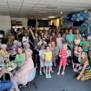 Volunteers and customers came together to mark the cafe's 20th birthday