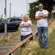 Georgie and John Allen want a section of the fence removed