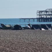 A tent encampment remains on Brighton beach