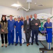 Richard Coles, pictured third from right, was invited by Nuffield Health Brighton Hospital to unveil a new piece of equipment