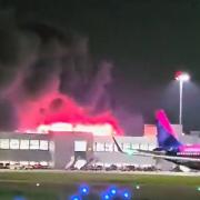 Flights have been grounded and Luton Airport closed amid a major blaze in a car park.