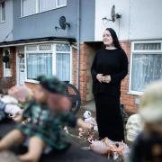 Lauren Angus has decorated her front garden with dozens of dolls