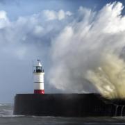 Newhaven lighthouse being battered by the waves during Storm Ciaran last year