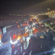 Drivers heading towards Brighton Marina up Duke's Mound as part of nationwide delivery driver strikes