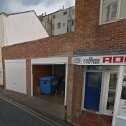 The plans are to demolish these garages and replace them with a two-storey building