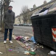 Rubbish left behind by workers in part of Hove. The city council said there were no collections due to lorries being tampered with. Pictured is Hove resident Robin Newbold