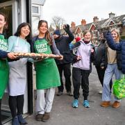 People queued up for freshly baked hot cross buns from Raven's Bakery in Brighton
