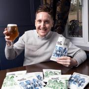Tom Lock celebrating the launch of the recyclable crisp packet