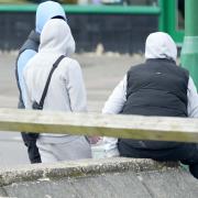 Fourteen young people have been arrested around Barnham after Sussex Police launched an operation to deal with youth crime. Pictured are three young people near Barnham Railway Station