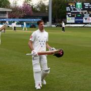 John Simpson takes the applause after his double century