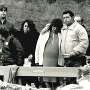 The Fellows and Hadaway families comforting each other at a memorial in 1987, from the Evening Argus