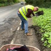 Janet Carver and Quentin Carpenter were forced to clear the pavement of North Trade Road