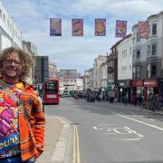Dave Pop! with his artwork in Brighton city centre