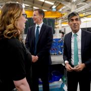 Prime Minister Rishi Sunak (right) and the Chancellor Jeremy Hunt (centre), during a visit to a business in Oxfordshire