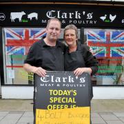 BANNED: Paul and Karen Clark of Clark's Butchers, Lewes Road with the banned advert