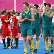 All over: Australia take the applause while, left of picture, Ashley Jackson is consoled