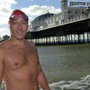 Local hero who swam the sea and set up charity honoured