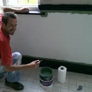 Giles Hippisley gets stuck in with some painting