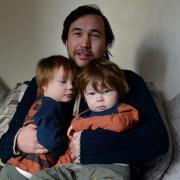 Tony Symons with his twin sons Thomas and Daniel
