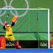 Maddie Hinch saves a penalty from Maartje Paumen during the final