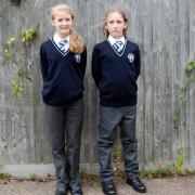 Priory School pupils Tilly and Paige in the new uniform.