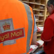 Royal Mail workers at a sorting office