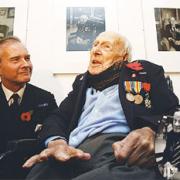Henry Allingham with Cdre Alistair Halliday and, inset, the portrait
