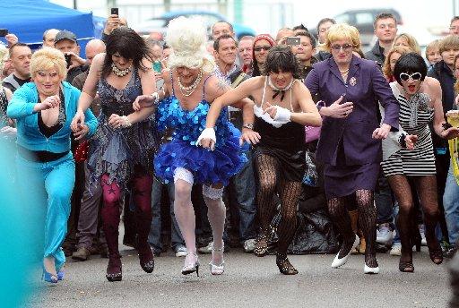 Bonnets and bawdy bets drew the crowds to an Easter parade and street party.
Children, pensioners and drag queens all played their part in fundraising |celebrations in aid |of The Sussex Beacon in Western Street, Brighton, on Sunday.
After a parade of b
