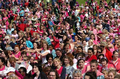 IN a sea of pink, it was the names pinned to ladies' T-shirts that told the story.
Women young and old stood limbering up, decked in pink, for the annual Race for Life at Stanmer Park on Sunday.
The sun came out as the crowd prepared to run, jog or walk
