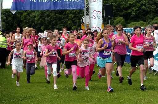 IN a sea of pink, it was the names pinned to ladies' T-shirts that told the story.
Women young and old stood limbering up, decked in pink, for the annual Race for Life at Stanmer Park on Sunday.
The sun came out as the crowd prepared to run, jog or walk