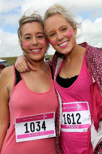 In a sea of pink, it was the names pinned to ladies' T-shirts that told the story.
Women young and old stood limbering up, decked in pink, for the annual Race for Life at Stanmer Park on Sunday.
The sun came out as the crowd prepared to run, jog or walk