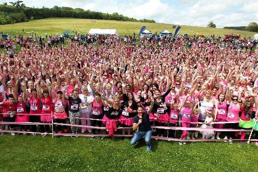 In a sea of pink, it was the names pinned to ladies' T-shirts that told the story.
Women young and old stood limbering up, decked in pink, for the annual Race for Life at Stanmer Park on Sunday.
The sun came out as the crowd prepared to run, jog or walk