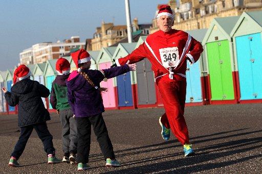 Hundreds of people dressed up as Santa to join in a 5k charity run in Hove