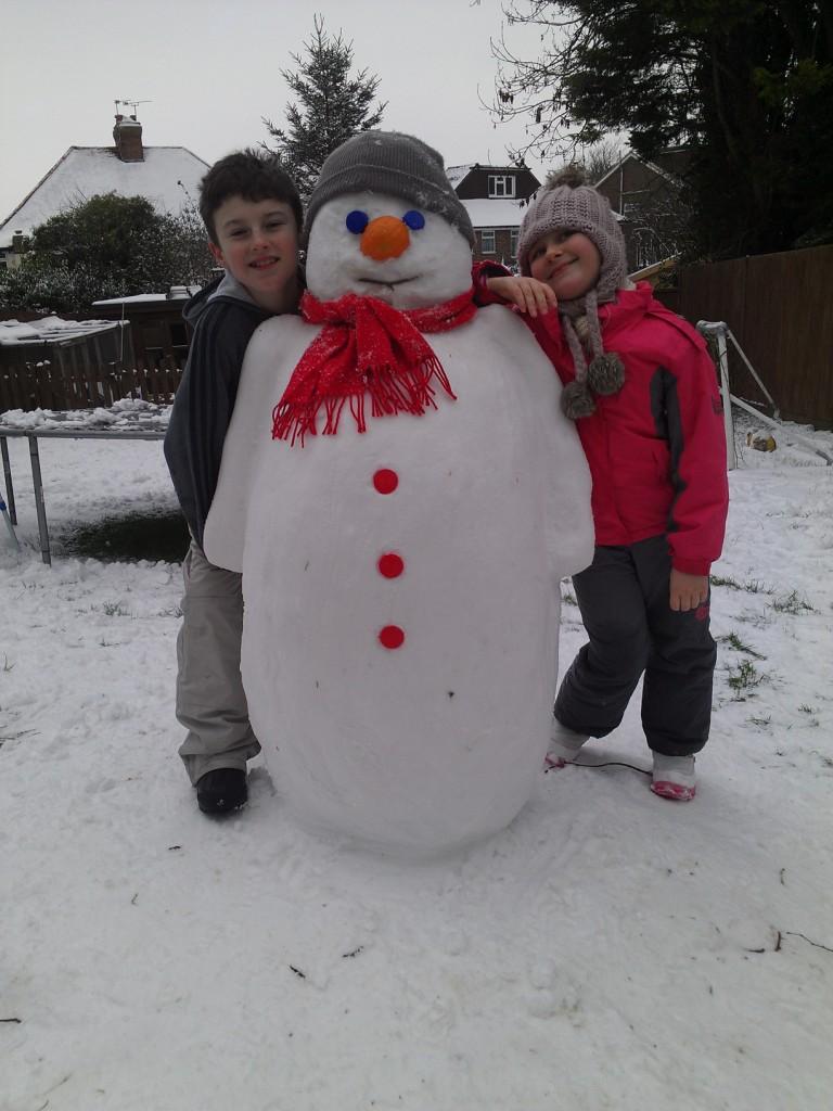 Ryan and Ria Cressweller with their snowman made in Patcham.

