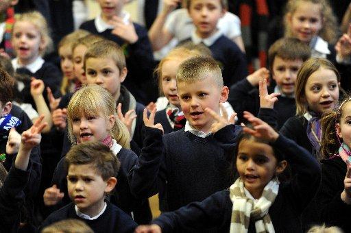 Children from Bevendean Primary School in Heath Hill Avenue, Brighton, joined with thousands of others across the UK in a bid to break the world record for singing and signing