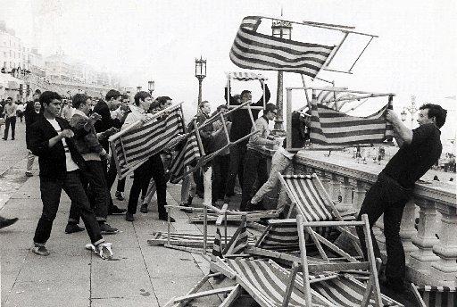 Group of Mods pictured throwing deckchairs fron the roof terrace of Brighton Aquarium on to Maderia Drive below.
