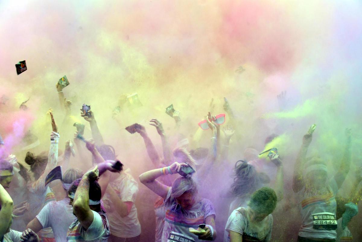A KALEIDOSCOPE of colour marked the start of Brighton’s first Color Run on Saturday morning.
A cloud of rainbow paint marked the start of the race at 11am on Madeira Drive, as 6,000 entrants joined the lively party atmosphere dressed from head to toe i