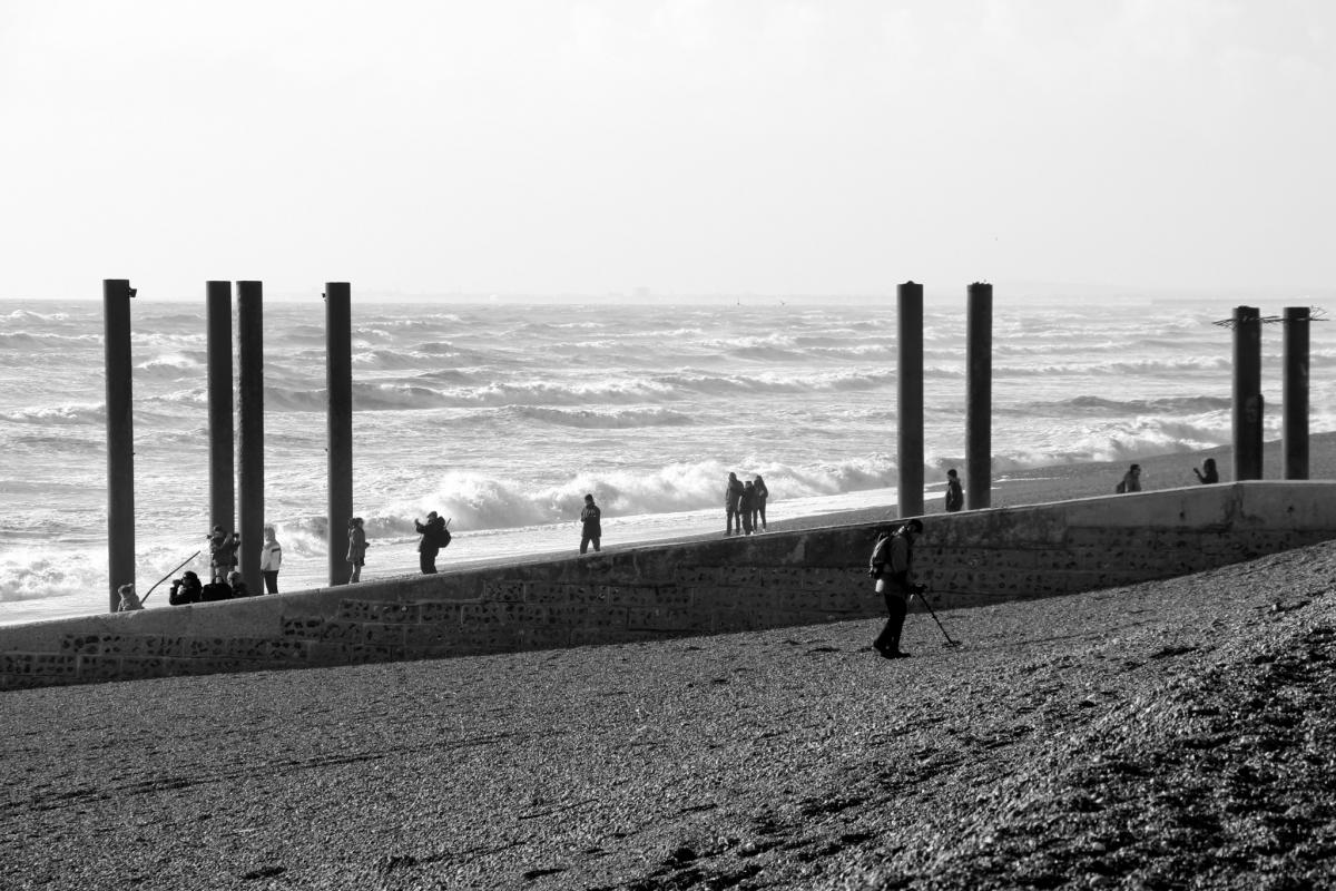 People taking pictures of the storm-ravaged West Pier. Picture by Ben Collier
