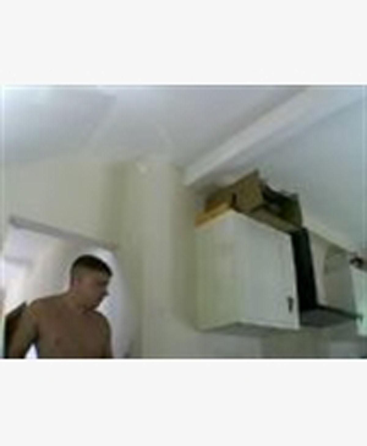 This unknown man is being sought in connection with a burglary in Redhill, Surrey, in July last year. 
